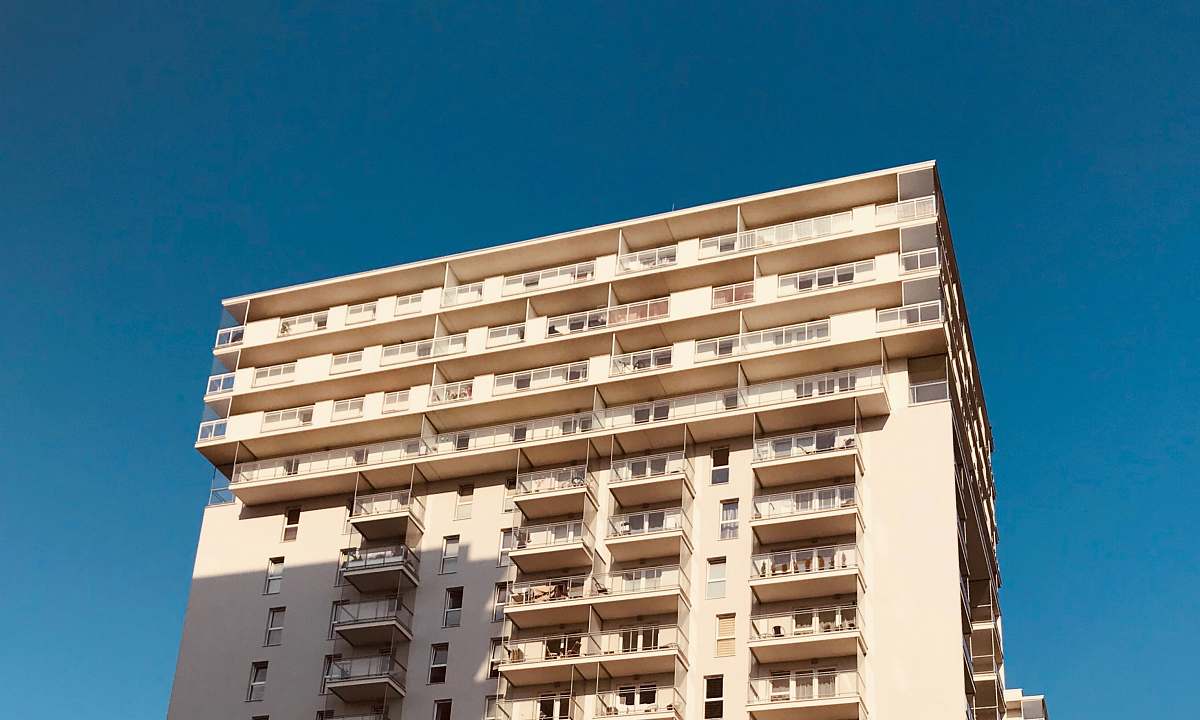 high rise high-rise building under blue sky town